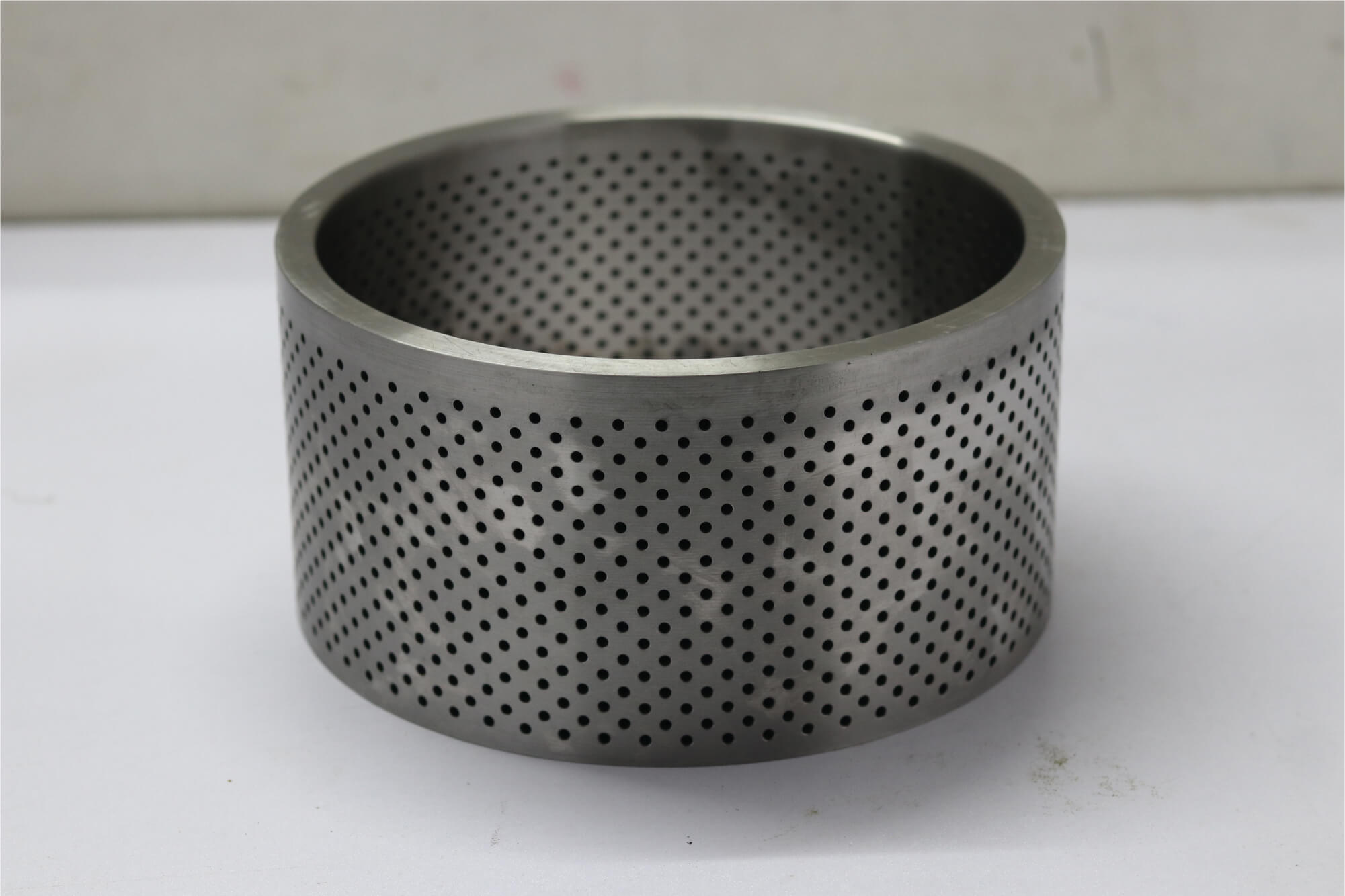 Perforated stainless steel ring component